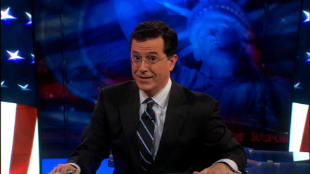 HD desktop wallpaper featuring the host of The Colbert Report in a suit, against a backdrop with an American flag motif.