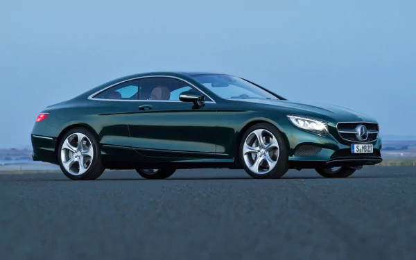 Green Mercedes-Benz S-Class Coupe on open tarmac, sleek luxury vehicle profile — HD PC desktop wallpaper and background showcasing Mercedes-Benz S-Class styling.