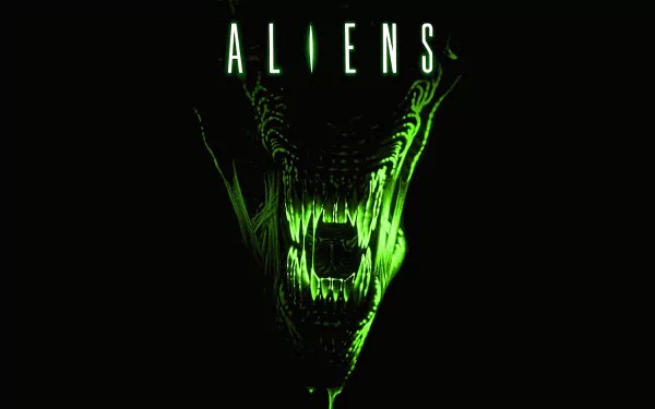 4K Ultra HD PC desktop wallpaper featuring a glowing green alien from the movie Aliens with sharp teeth and ominous dark background.