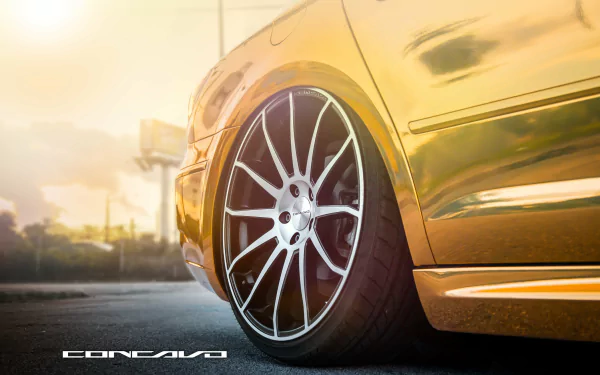 Golden Volkswagen CC close-up of wheel and side panel at sunset — 4K Ultra HD PC desktop wallpaper of a Volkswagen vehicle.