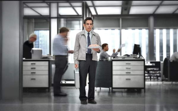 Solitary office worker holding papers in a modern newsroom, HD PC desktop wallpaper inspired by the movie The Secret Life of Walter Mitty.