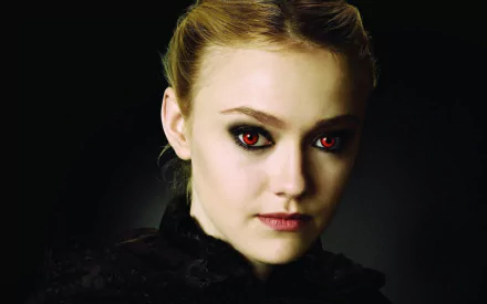 A striking HD desktop wallpaper featuring American actress Dakota Fanning, showcasing her intense gaze with dramatic makeup and a dark backdrop.