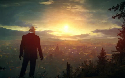A striking HD wallpaper from Hitman: Absolution, featuring the iconic character silhouetted against a vibrant sunset over a sprawling cityscape.