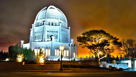 HD desktop wallpaper featuring the illuminated Baha'i Temple at night, showcasing its religious architecture against a dramatic sky.