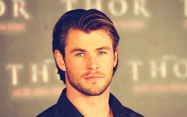 HD desktop wallpaper of Australian actor and celebrity Chris Hemsworth with a neutral expression against a blurred background featuring Thor text.