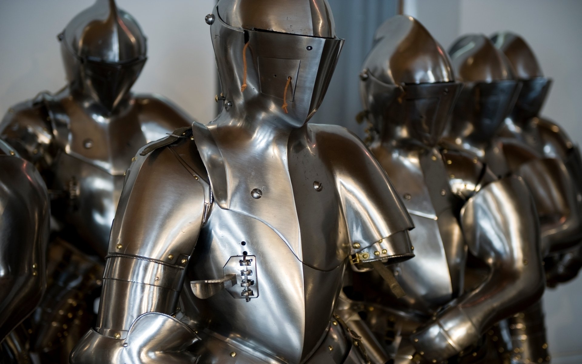 HD PC desktop wallpaper/background showing man-made polished plate armor suits in formation, gleaming steel reflections and detailed rivets.