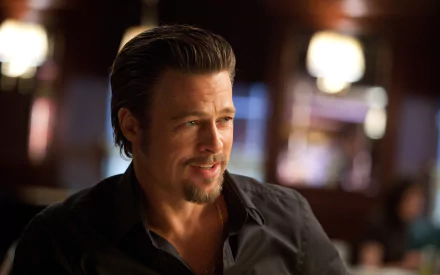 4K Ultra HD wallpaper of American actor Brad Pitt in a scene from the movie Killing Them Softly, showcasing a close-up with warm, dim lighting.