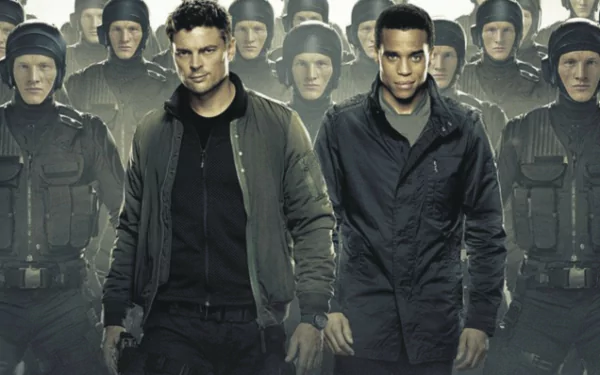 HD wallpaper featuring Karl Urban from the series Almost Human, with characters in futuristic police attire, ready for action.