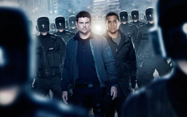 HD wallpaper of 'Almost Human' featuring Karl Urban, with shadowy figures in the background, evoking a futuristic setting.