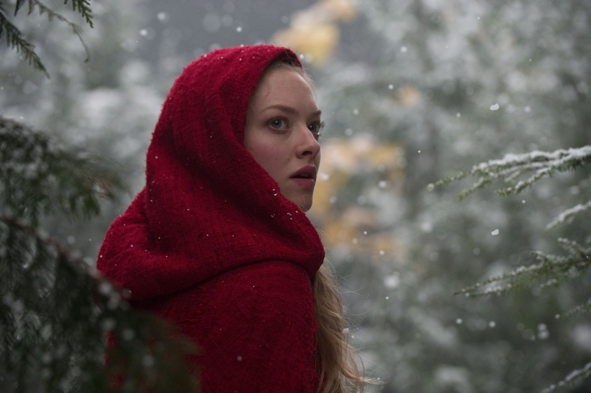 HD desktop wallpaper featuring Amanda Seyfried as Red Riding Hood in a snowy forest scene from the movie.