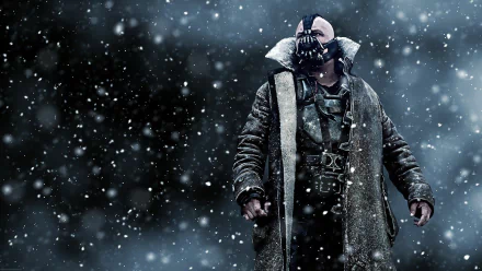 Bane from DC Comics stands formidable in a snowy landscape, inspired by his role in *The Dark Knight Rises*. A striking HD wallpaper for fan enthusiasts.