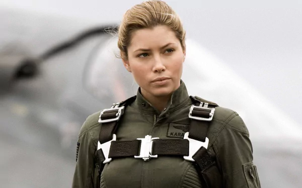 HD PC desktop wallpaper featuring a character from the movie Stealth in a flight suit with a blurred aircraft in the background.