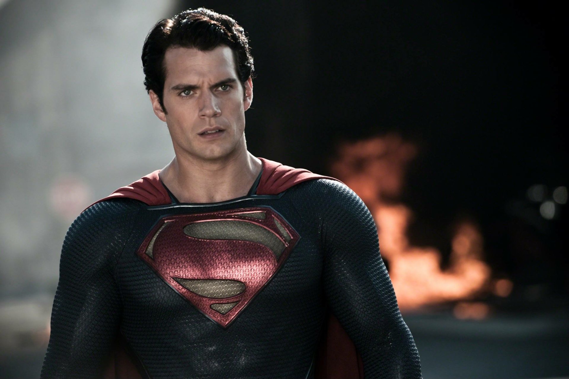 Henry Cavill as Superman in his iconic suit from the movie Man of Steel, featured in a high-definition PC desktop wallpaper background.