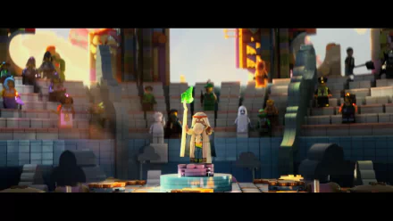 HD PC desktop wallpaper/background: LEGO's Vitruvius (The LEGO Movie) stands on a temple pedestal holding a glowing green staff as crowds watch in a cinematic movie scene.