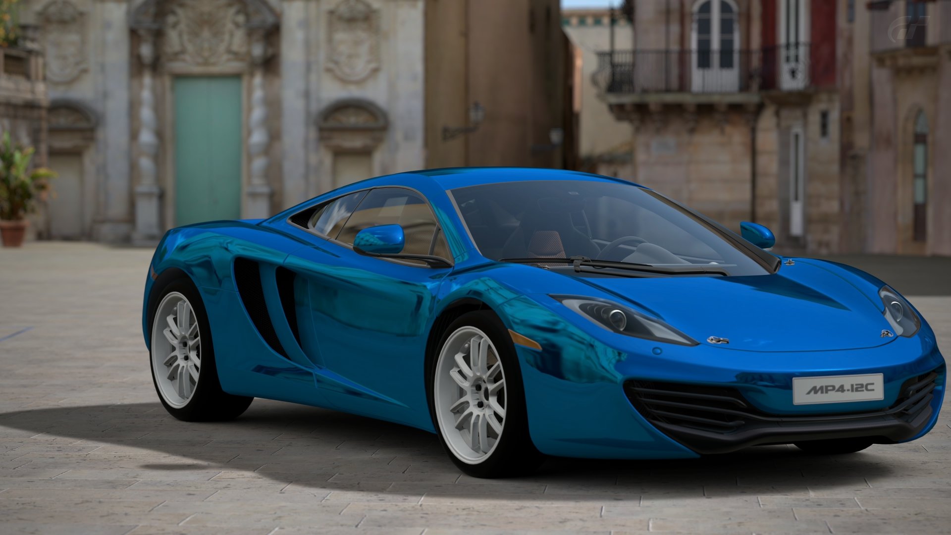 Sleek blue supercar rendered in Gran Turismo 6 (gran turismt6), 4K Ultra HD video game PC desktop wallpaper/background, parked on a sunlit historic plaza with glossy reflective paint.