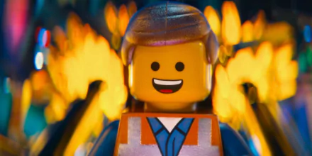 HD PC wallpaper featuring Emmet from The Lego Movie, showcasing the iconic Lego character with a vibrant fiery background.