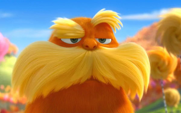 The Lorax from the movie, close-up with a large yellow mustache against colorful Truffula trees — 2K Quad HD PC desktop wallpaper and background.