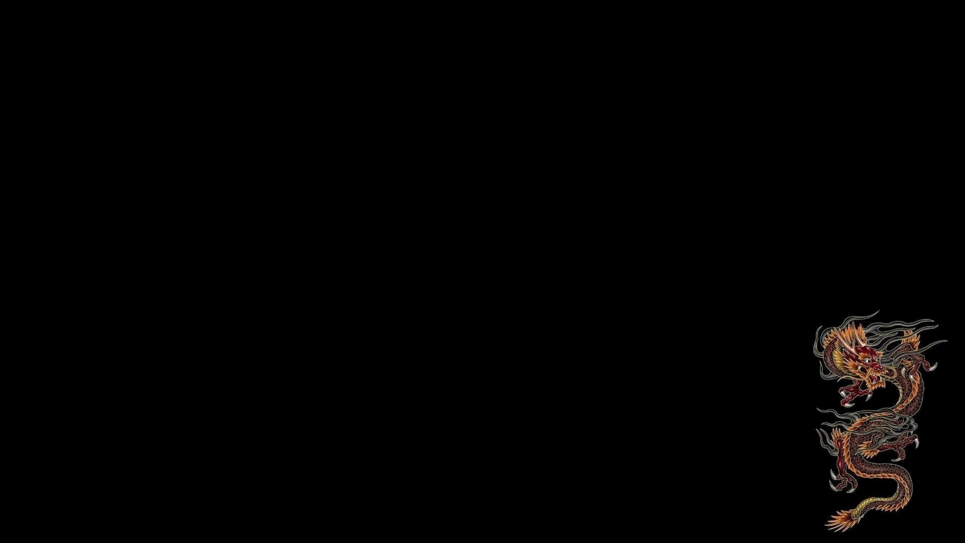 HD fantasy PC desktop wallpaper featuring a detailed, fiery dragon curling against a black background.