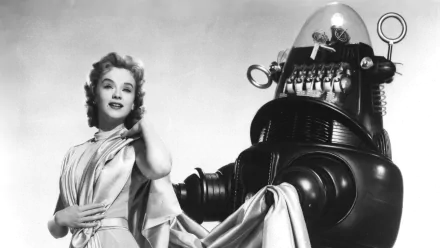 A classic scene from the movie *Forbidden Planet*, featuring Robby the Robot alongside Anne Francis, captured in a high-definition black and white wallpaper.