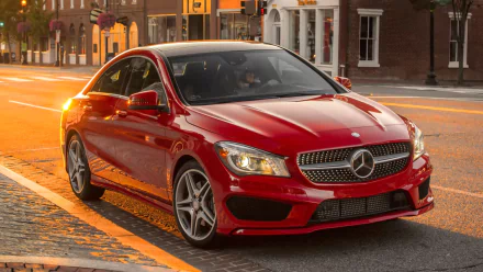 A red Mercedes-Benz CLA-Class parked on a city street at sunset, captured in an HD PC desktop wallpaper and background.