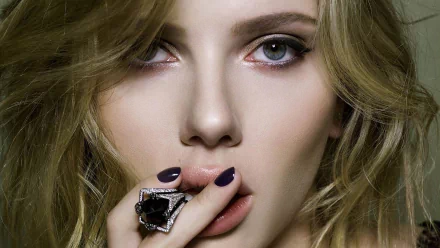 HD desktop wallpaper featuring a close-up of Scarlett Johansson, showcasing her striking features, elegant makeup, and stylish jewelry against a soft backdrop.