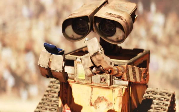 A vibrant HD wallpaper featuring Wall·E, the beloved robot character from the movie, showcasing his inquisitive nature as he holds a small object in his hands.
