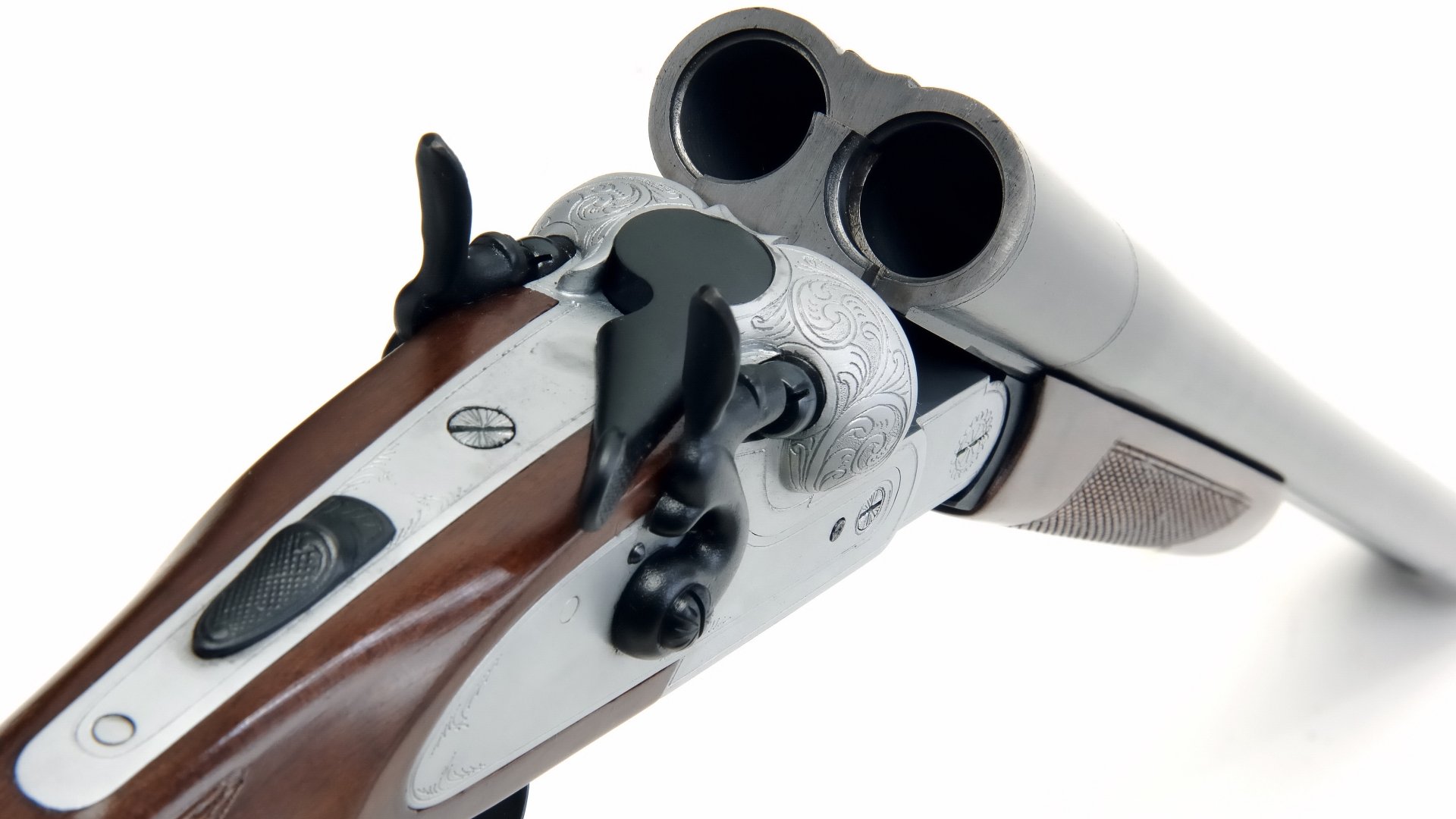 A close-up of a beautifully crafted double-barrel shotgun, showcasing intricate details of the wood and metalwork, set against a clean background for an HD desktop wallpaper.