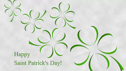 A vibrant HD desktop wallpaper celebrating St. Patrick's Day, featuring elegant green shamrocks and the greeting, Happy Saint Patrick's Day! in festive typography.