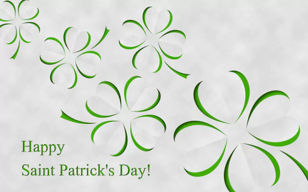 A vibrant HD desktop wallpaper celebrating St. Patrick's Day, featuring elegant green shamrocks and the greeting, Happy Saint Patrick's Day! in festive typography.
