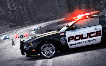 A thrilling scene from Need For Speed: Hot Pursuit featuring a police car in pursuit on a winding road, surrounded by other racing vehicles. HD wallpaper setting for gaming enthusiasts.