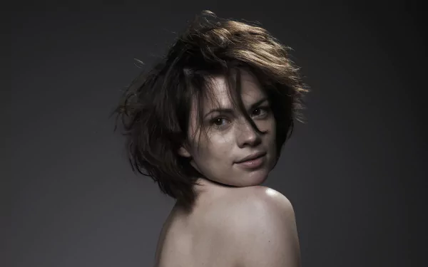 HD desktop wallpaper of English actress and celebrity Hayley Atwell, featuring a close-up portrait with a neutral gray background.