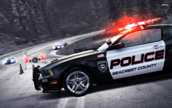 A thrilling scene from Need For Speed: Hot Pursuit featuring a police car in pursuit on a winding road, surrounded by other racing vehicles. HD wallpaper setting for gaming enthusiasts.