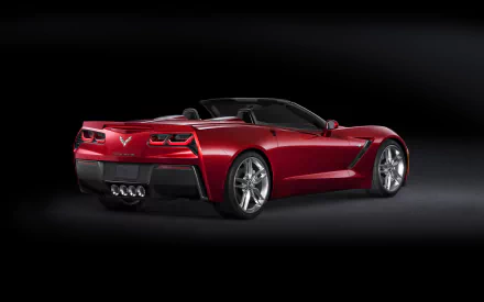 Red Chevrolet Corvette Stingray convertible vehicle on a black backdrop, rear three-quarter view — 2K Quad HD PC desktop wallpaper background.