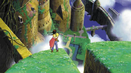 HD PC desktop wallpaper of Laputa: Castle in the Sky — two characters embrace on a grassy cliff, overlooking the floating island's ancient towers, bridges and misty clouds.