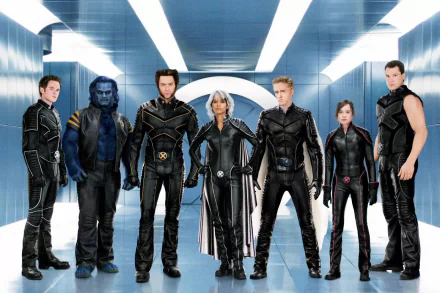 A group of X-Men characters, including Colossus, Iceman, Kitty Pryde, Angel, Storm, Wolverine, and Beast, stand confidently in a sleek, futuristic hallway from *X-Men: The Last Stand*.