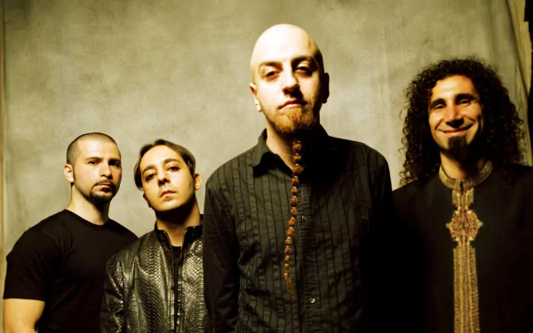 High-definition desktop wallpaper featuring the band System Of A Down. Four band members are standing together against a plain background, with a focused and intense look.