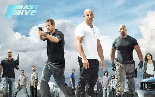 HD wallpaper featuring the cast of the movie Fast Five, showcasing an intense action scene with characters in front of a cloudy sky backdrop.