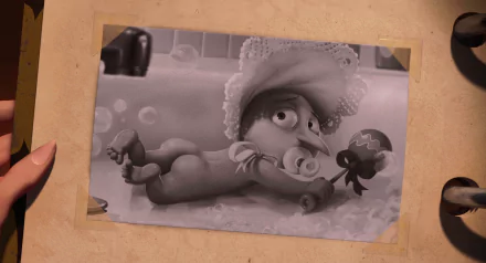 Black-and-white HD PC desktop wallpaper of Baby Gru from the movie Despicable Me, wearing a bonnet and holding a rattle.