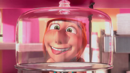 HD PC desktop wallpaper featuring Lucy from the movie Despicable Me 2, shown smiling inside a transparent cake dome with a vibrant pink background.