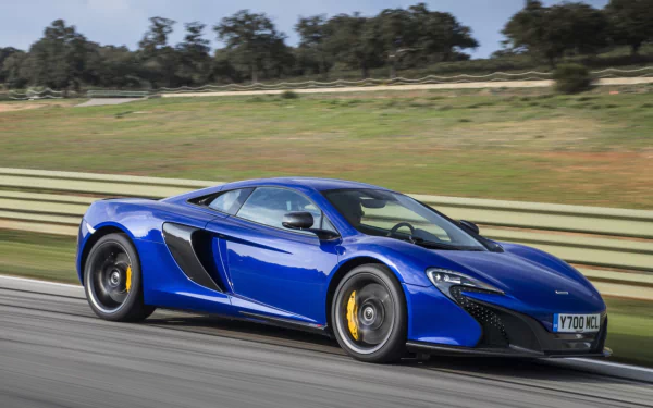 Blue McLaren 650S supercar racing on a track, high-performance car depicted as an HD PC desktop wallpaper/background.
