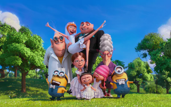 A vibrant HD wallpaper featuring characters from Despicable Me 2: Lucy, Margo, Edith, Agnes, Dr. Nefario, Gru, and Minions, smiling together in a lush green setting.