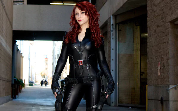 A woman in a detailed black cosplay outfit poses confidently in an urban setting. This vibrant image serves as a striking 4K Ultra HD desktop wallpaper.