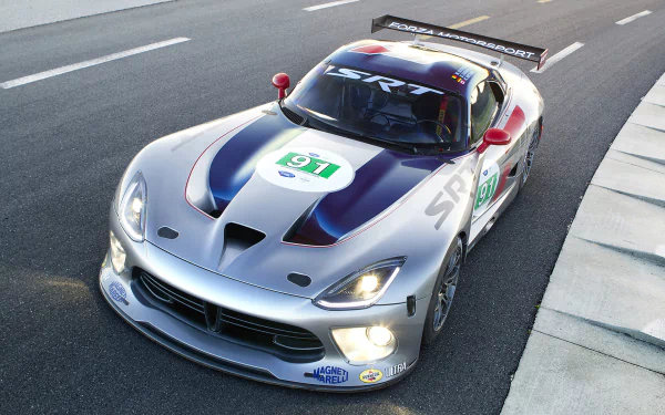 HD PC desktop wallpaper of a Dodge Viper GTS-R racing vehicle on track, silver livery with dark stripes, race number and prominent rear wing.