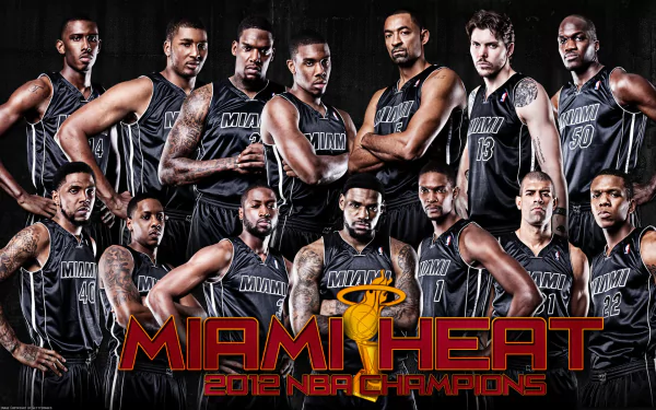 HD wallpaper of the Miami Heat 2012 NBA Champions team posing in black uniforms with the team logo in the forefront.
