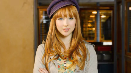 A high-definition desktop wallpaper featuring American actress Molly Quinn, showcasing her vibrant red hair and stylish purple hat in a casual pose.