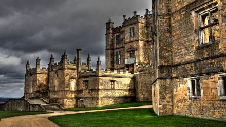 HD desktop wallpaper of Bolsover Castle showcasing its historic, man-made stone architecture under a moody sky.