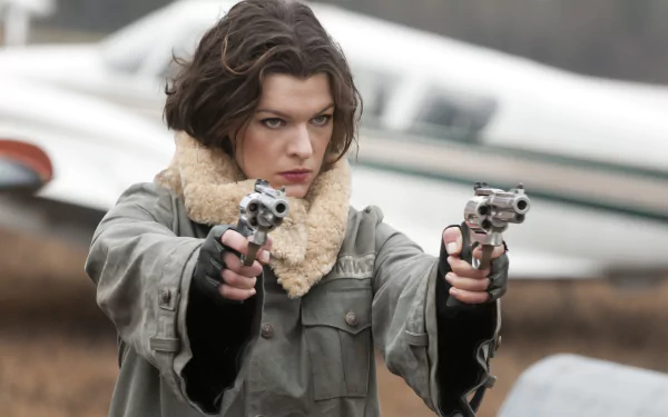 Milla Jovovich, armed with twin handguns, portrays a fierce character in Resident Evil: Afterlife, captured in this dynamic 4K Ultra HD desktop wallpaper.
