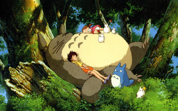 A vibrant HD wallpaper featuring Satsuki and Mei Kusakabe relaxing on Totoro's belly, surrounded by Mini Totoros in a lush green forest from *My Neighbor Totoro*.