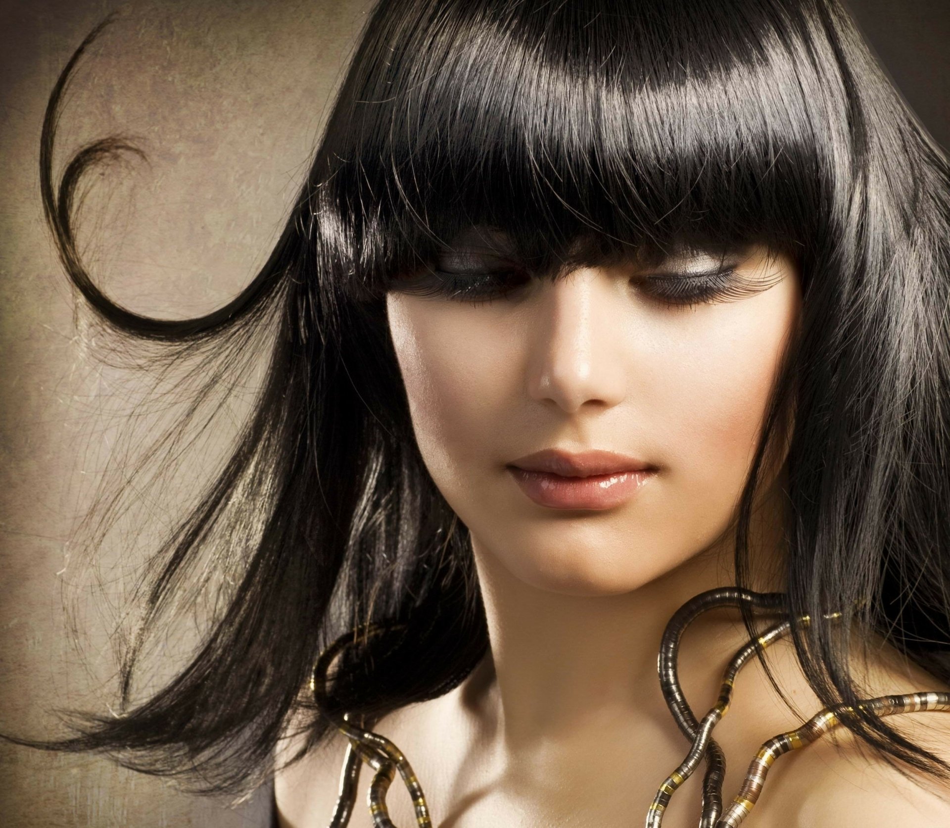 HD desktop wallpaper featuring a close-up portrait of a woman with dark hair and soft makeup, tagged with Judy Wilkins.