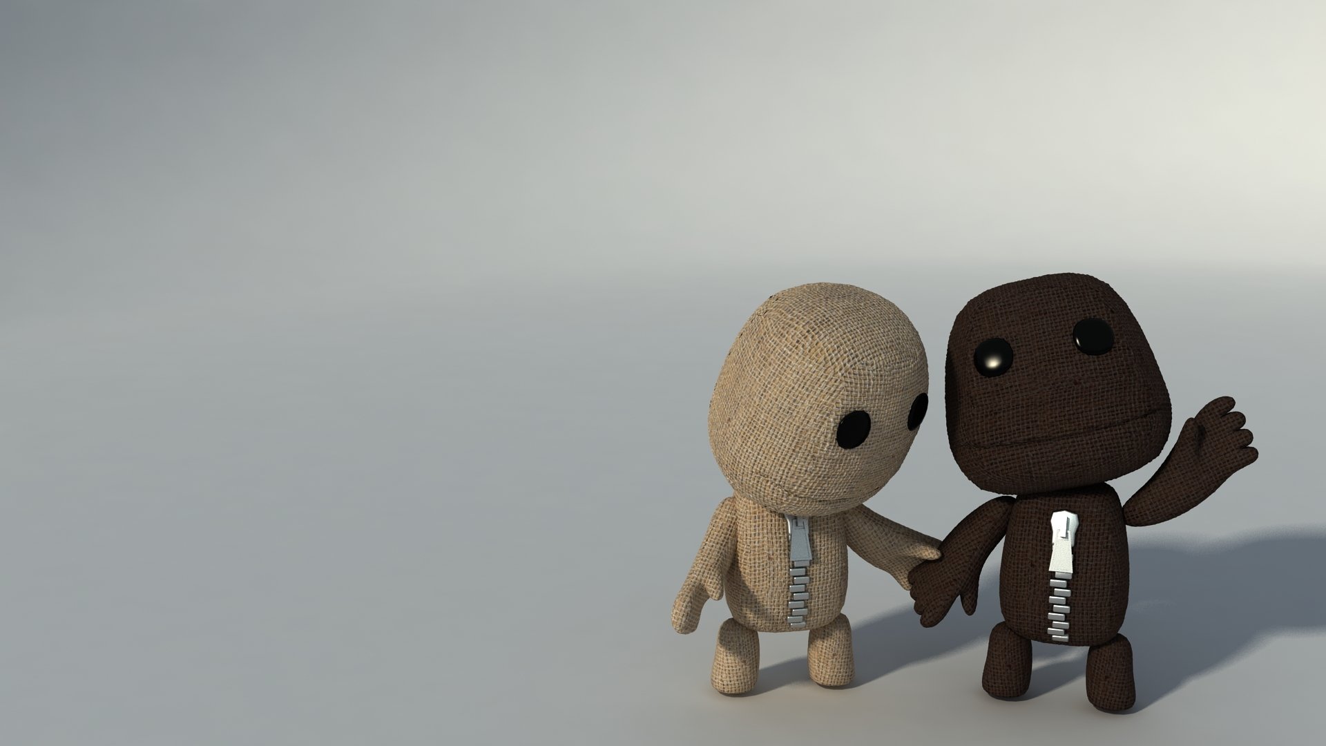 HD desktop wallpaper featuring two LittleBigPlanet characters holding hands against a soft gray background.